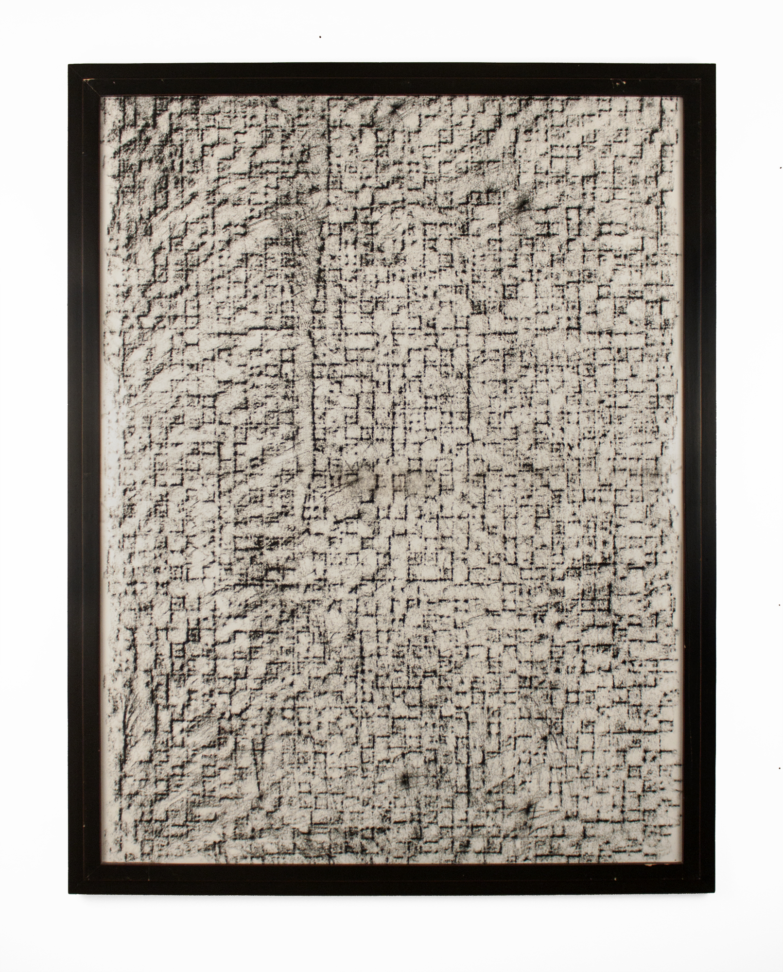 Charcoal rubbing of tile wall with crack down vertical center.